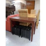 A brown leather side table and pair of black leather storage stools