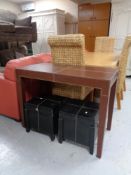 A brown leather side table and pair of black leather storage stools