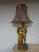 A gilt chalk table lamp in the form of lovers,