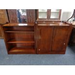 An inlaid mahogany double door cabinet and matching bookshelves