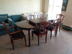 A late twentieth century oval extending table and set of six shield backed chairs