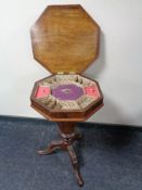 A Victorian walnut pedestal work table