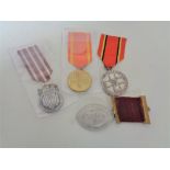 Four Polish medals with ribbons.