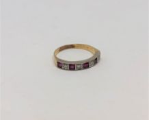 A ruby and diamond half eternity ring, 18CT size O.