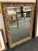 A decorative bevelled gilt framed mirror,
