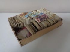 A box of a quantity of assorted tea and sweet cigarette cards together with two English crowns