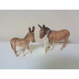 Two Beswick donkey foals.