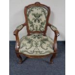 A continental walnut armchair in tapestry fabric