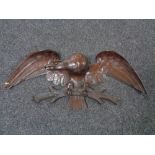 A teak carved figure of an eagle