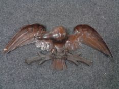 A teak carved figure of an eagle