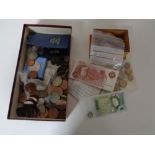 A box of a large quantity of pre-decimal British coins and banknotes, George III silver coin,