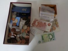 A box of a large quantity of pre-decimal British coins and banknotes, George III silver coin,