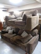 A contemporary two seater and three seater settees in brown fabric with scatter cushions