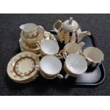 A tray of teapot sugar basin and milk jug together with a twenty one piece Roslyn tea service