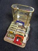 A tray of brass and glass counter top display cabinet quantity of die cast vehicles, Days Gone By,