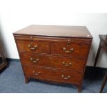A Georgian mahogany Gentleman's four drawer chest with brass drop handles CONDITION