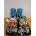 A tray of decorative Chinese dog figures