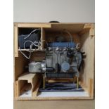 A scratch built plastic model of a combustion engine in wooden crate