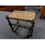An early 20th century bergere seated stool