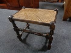 An early 20th century bergere seated stool