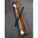 A 20th century mahogany fishing box containing split cane fly rods,