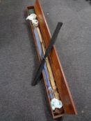 A 20th century mahogany fishing box containing split cane fly rods,