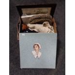 A box of table linen, gloves, purses,