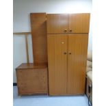 A teak effect double door wardrobe with top cupboard together with a twentieth century teak