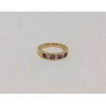 An 18ct gold ruby and diamond ring, size J CONDITION REPORT: 2.