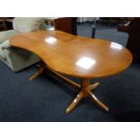 A shaped beech twin pedestal dining table