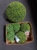 A box of topiary balls