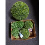 A box of topiary balls