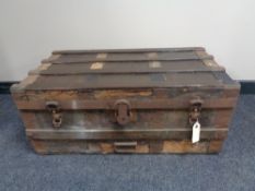 An antique metal bound wooden trunk