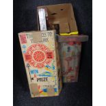 A box of vintage and later toys to include boxed Bagatelle, NFL shirt,