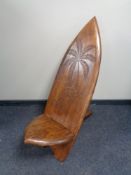 A carved hardwood fertility chair