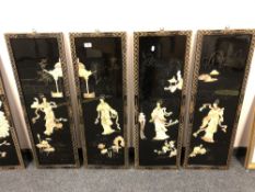 A set of four Japanese lacquered panels depicting geisha,