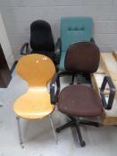 A pair of beech chairs on metal legs and three swivel office chairs
