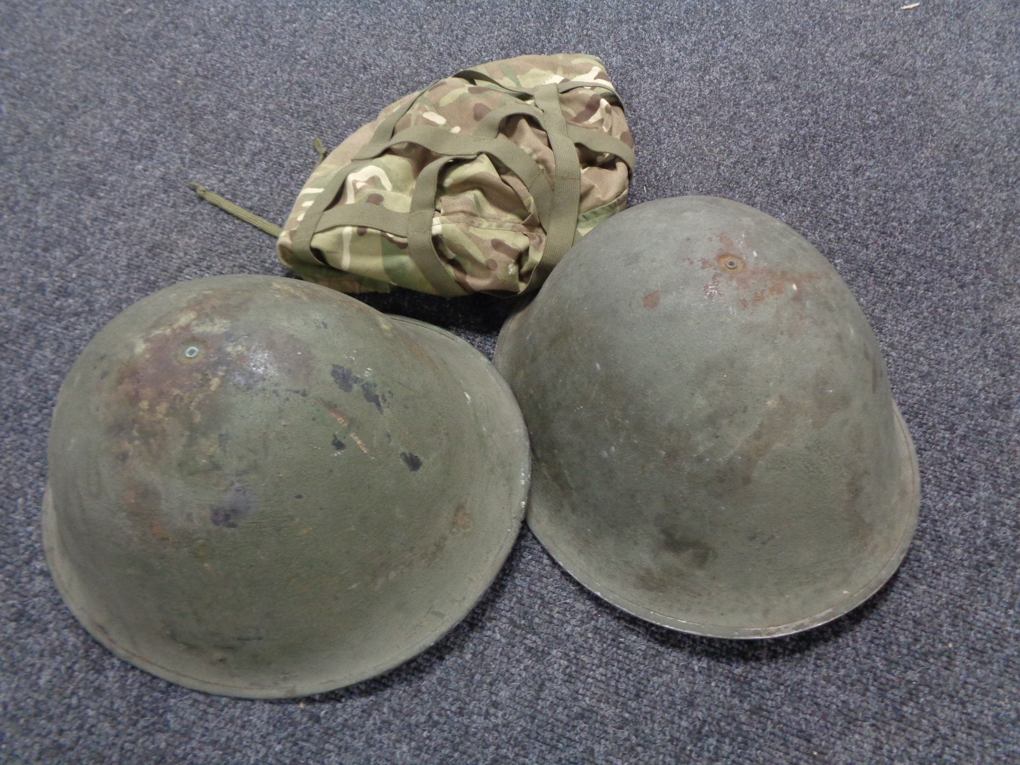 Two WW II steel helmets