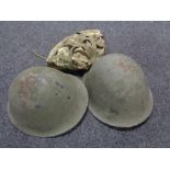 Two WW II steel helmets
