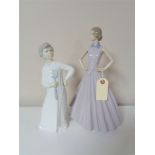 Two large Nao figures - lady in dress and a boy