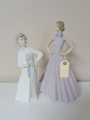 Two large Nao figures - lady in dress and a boy