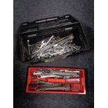 A plastic tool box of a large quantity of spanners