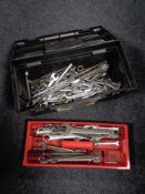 A plastic tool box of a large quantity of spanners