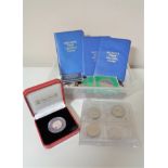 A box of various coins, Pobjoy mint coin in box,