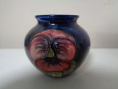 A small Moorcoft tubelined vase.