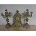 A continental gilt three piece clock garniture