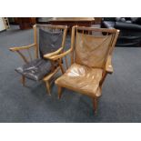 A pair of mid 20th century teak armchairs with leather cushions