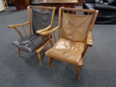 A pair of mid 20th century teak armchairs with leather cushions