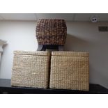 A pair of wicker storage stools and a further wicker stool