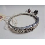 A pair of Art Deco silver and marcasite earrings, together with a silver and marcasite bangle,